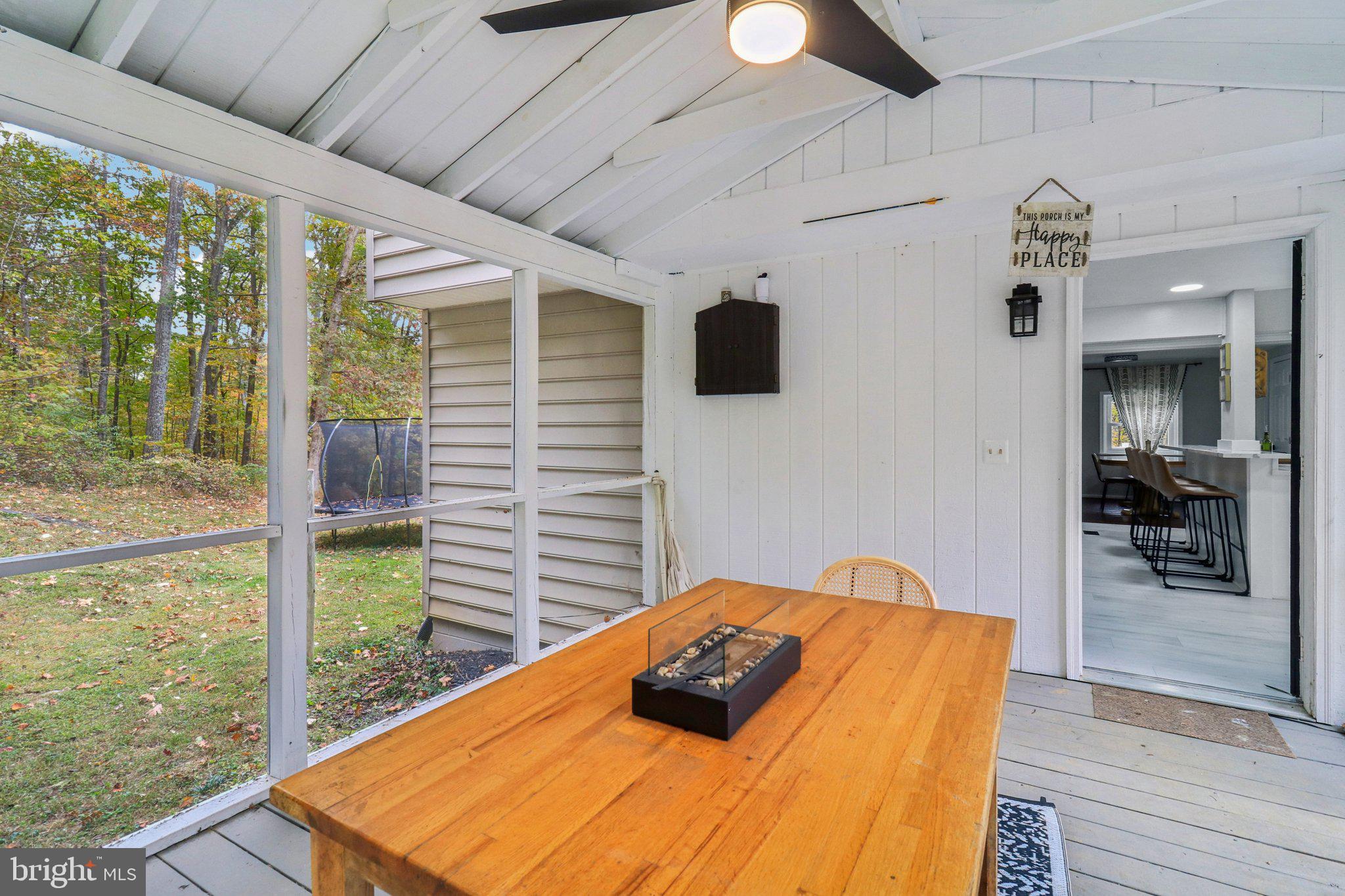 9830 Wineberry Road Marshall, VA 20115 - Photo 75 of 105 a bedroom with a bed and glass door
