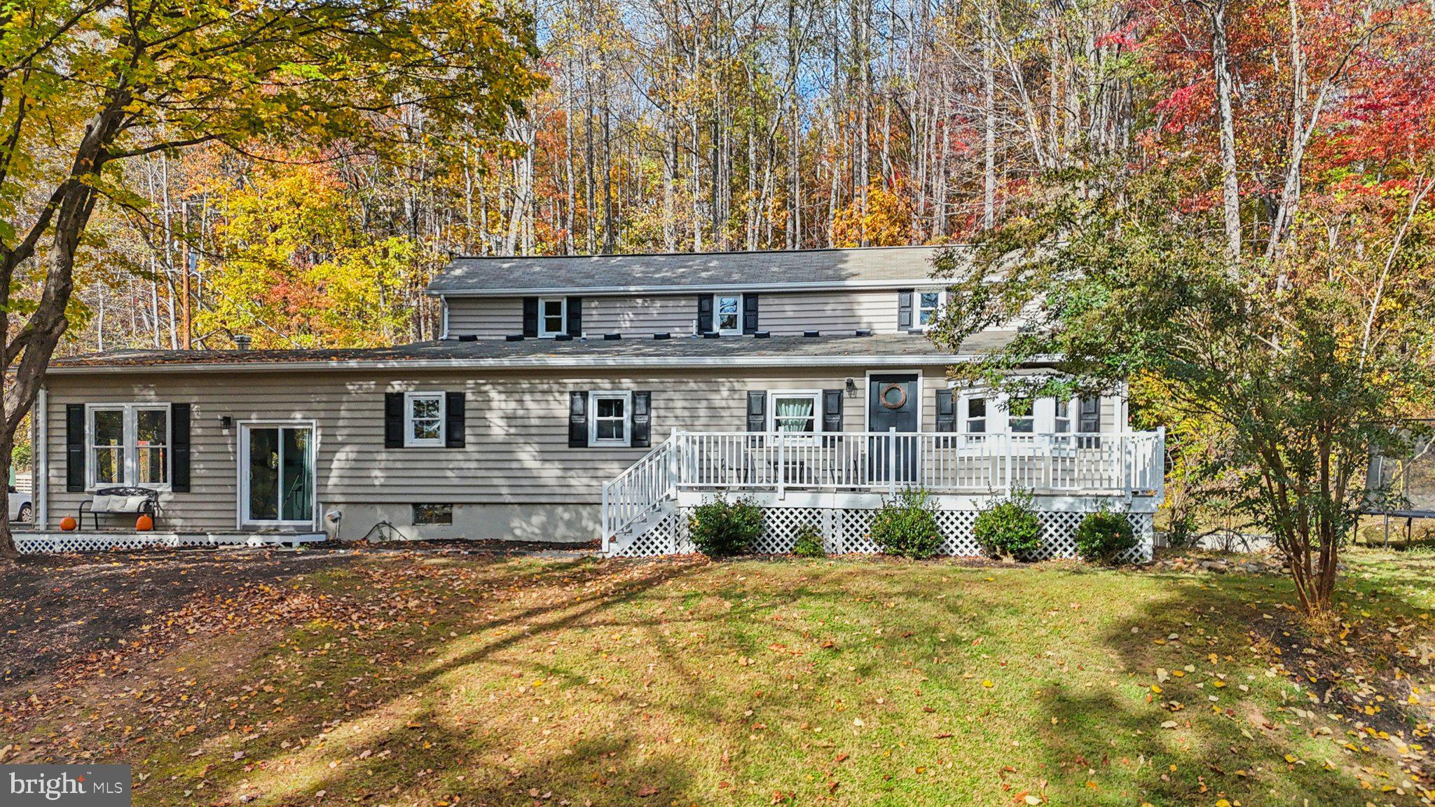 9830 Wineberry Road Marshall, VA 20115 - Photo 87 of 105 a front view of a house with a garden