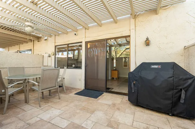 a bathroom with a granite countertop sink a large mirror and a toilet