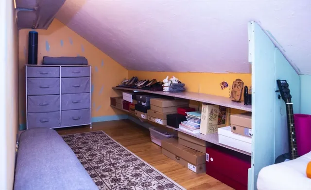 a room with toys and dresser