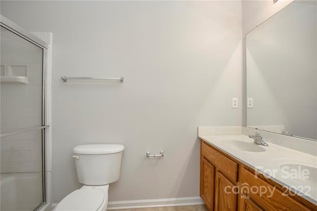 16852 Timber Crossing Road Charlotte, NC 28213 - Photo 12 of 31 a bathroom with a sink and a toilet