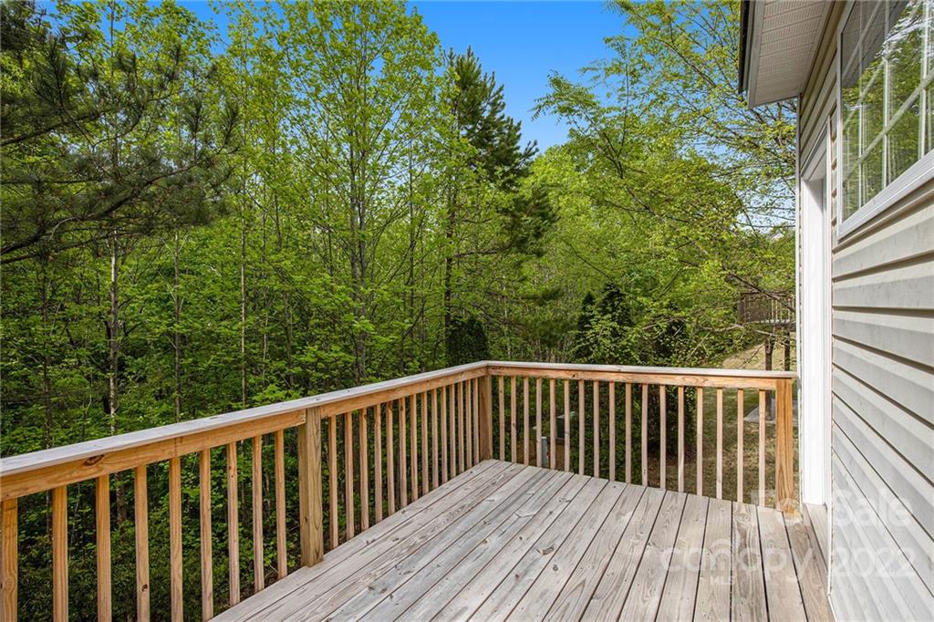 16852 Timber Crossing Road Charlotte, NC 28213 - Photo 14 of 31 a balcony with wooden floor and fence