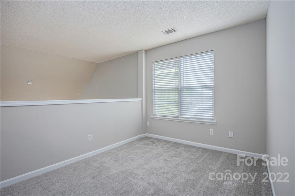 16852 Timber Crossing Road Charlotte, NC 28213 - Photo 15 of 31 a view of an empty room with a window