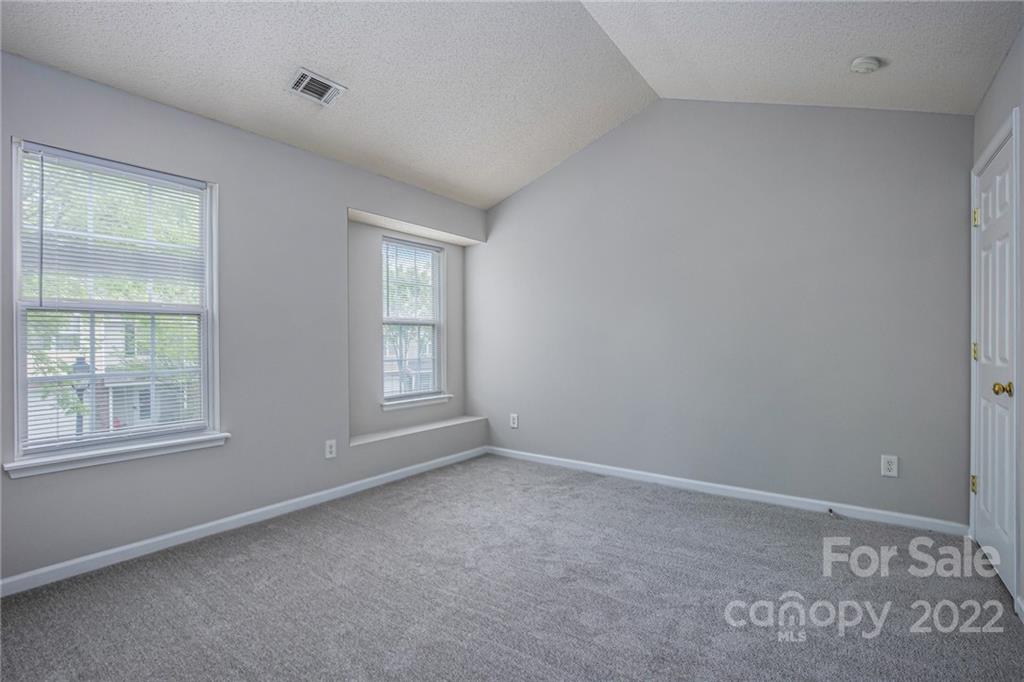 16852 Timber Crossing Road Charlotte, NC 28213 - Photo 17 of 31 a view of an empty room with a window
