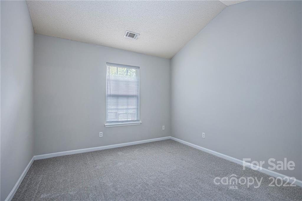 16852 Timber Crossing Road Charlotte, NC 28213 - Photo 19 of 31 an empty room with a window