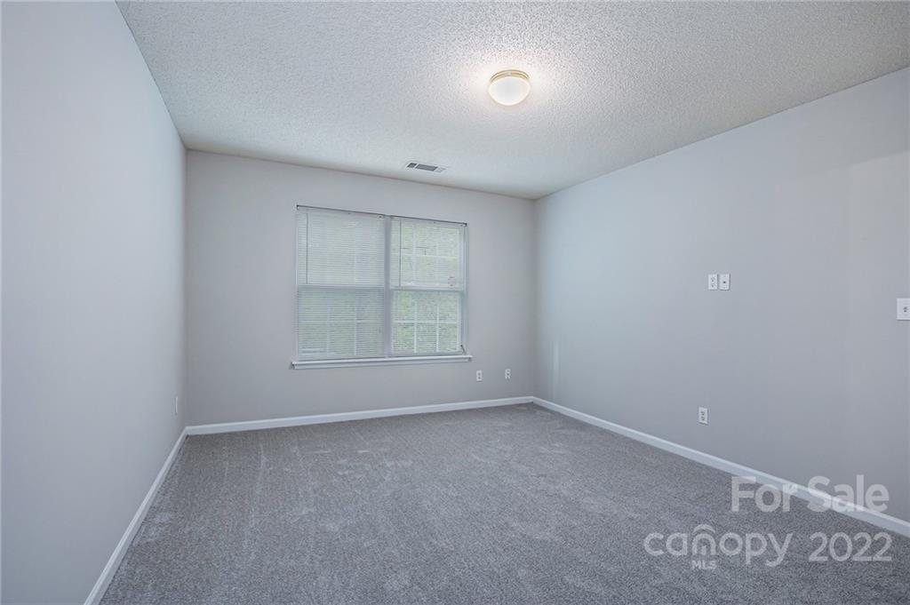 16852 Timber Crossing Road Charlotte, NC 28213 - Photo 20 of 31 an empty room with a empty space and window