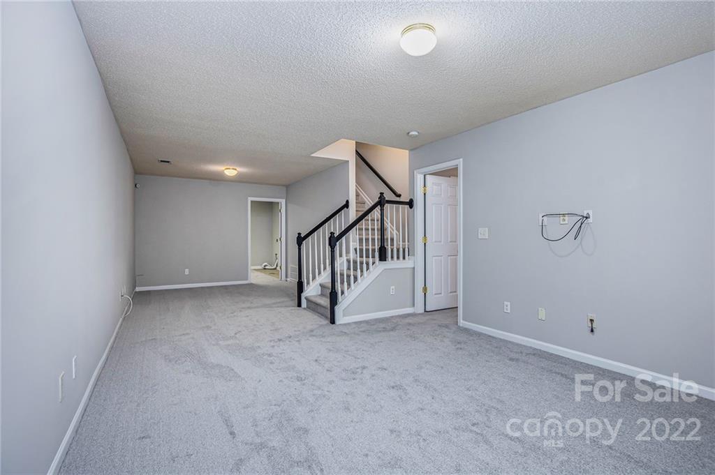 16852 Timber Crossing Road Charlotte, NC 28213 - Photo 21 of 31 a view of an empty room with stairs