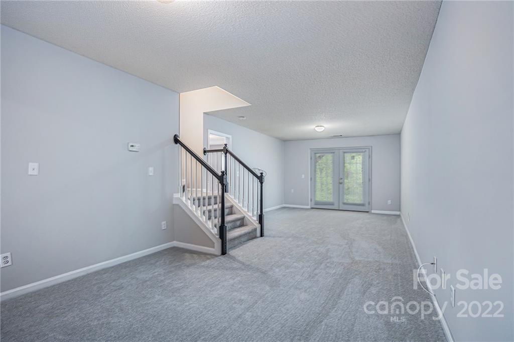 16852 Timber Crossing Road Charlotte, NC 28213 - Photo 22 of 31 a view of an empty room with stairs