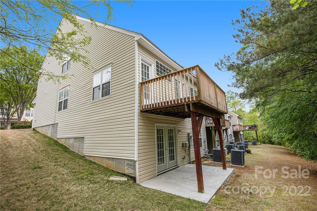 16852 Timber Crossing Road Charlotte, NC 28213 - Photo 29 of 31 a view of a house with a patio
