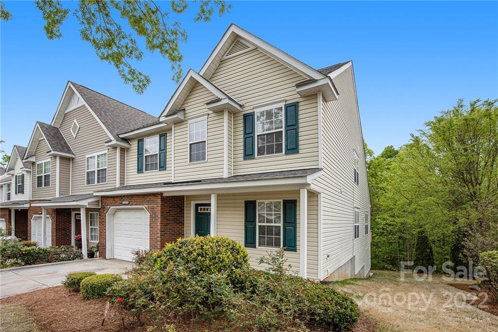 16852 Timber Crossing Road Charlotte, NC 28213 - Photo 31 of 31 a view of a white house next to a yard