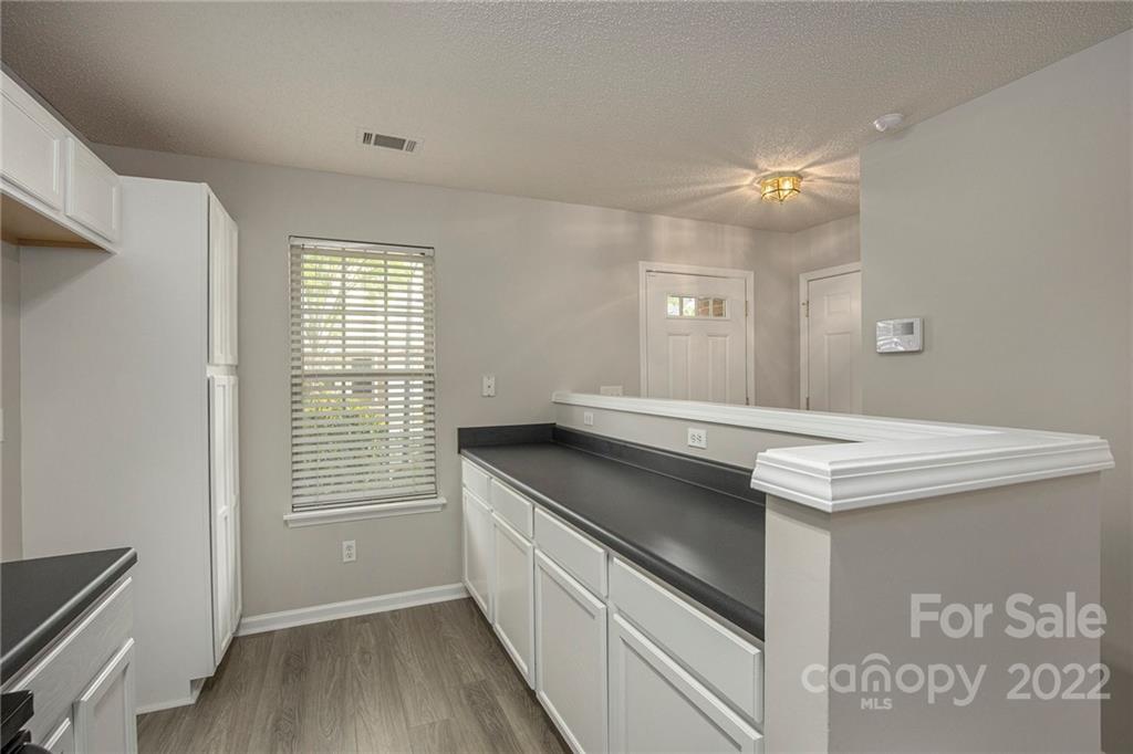 16852 Timber Crossing Road Charlotte, NC 28213 - Photo 4 of 31 a kitchen with a stove and a window