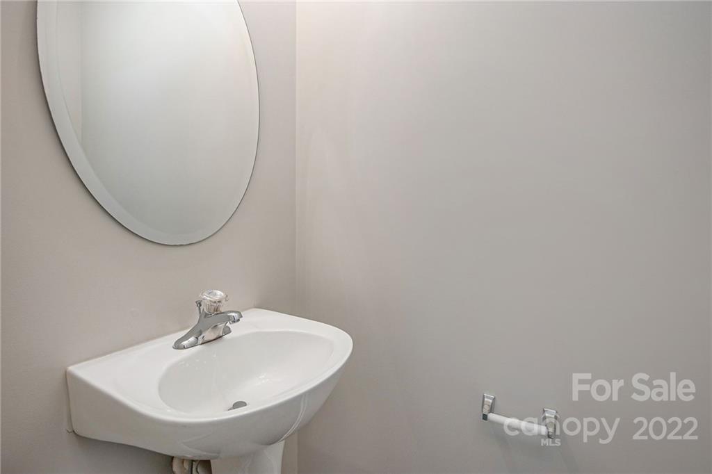 16852 Timber Crossing Road Charlotte, NC 28213 - Photo 6 of 31 a bathroom with a sink and a mirror