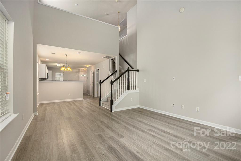 16852 Timber Crossing Road Charlotte, NC 28213 - Photo 8 of 31 a view of a hallway view with wooden floor and staircase