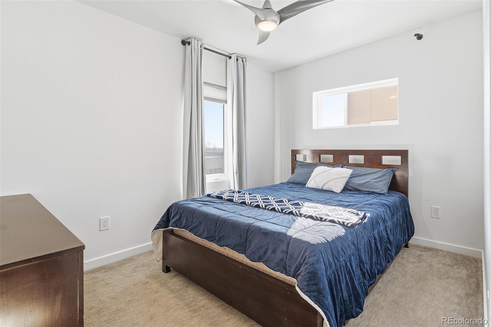 3850 West 13th Avenue Denver, CO 80204 - Photo 13 of 32 a bedroom with a bed and a window