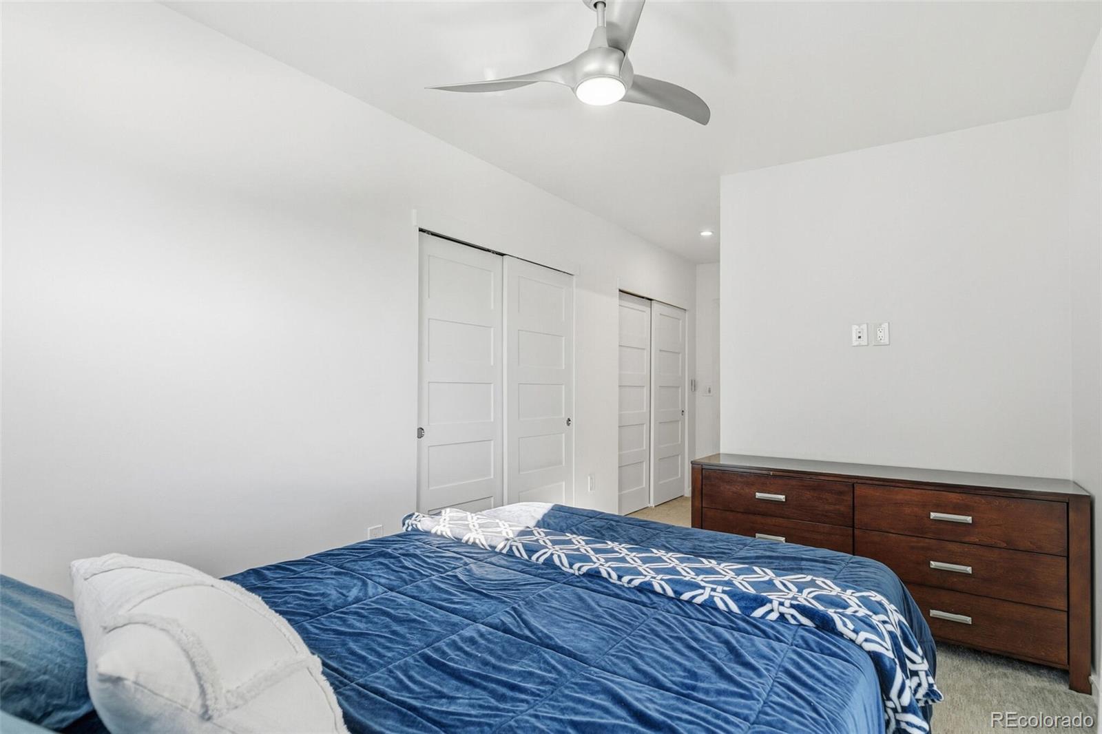 3850 West 13th Avenue Denver, CO 80204 - Photo 14 of 32 a bedroom with a bed and a dresser