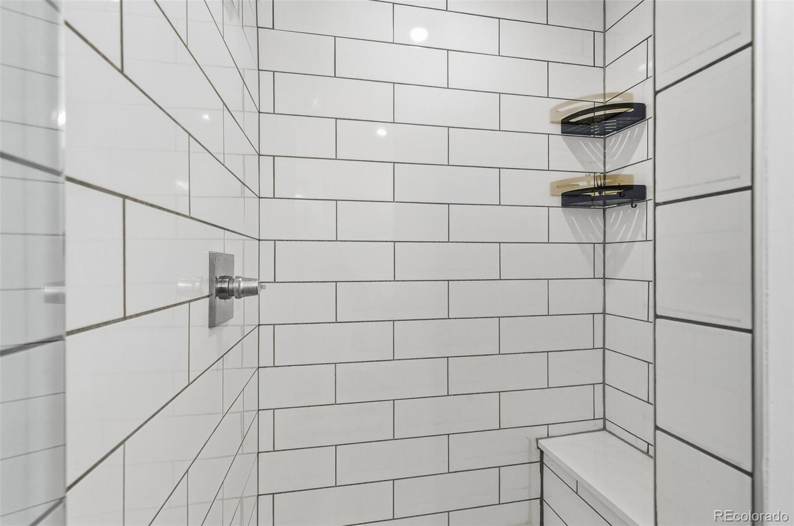 3850 West 13th Avenue Denver, CO 80204 - Photo 17 of 32 a bathroom with a shower