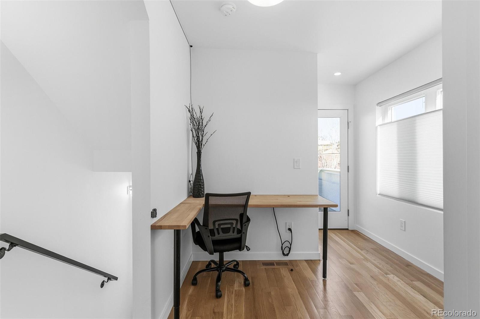 3850 West 13th Avenue Denver, CO 80204 - Photo 19 of 32 a view of a workspace with furniture and a window