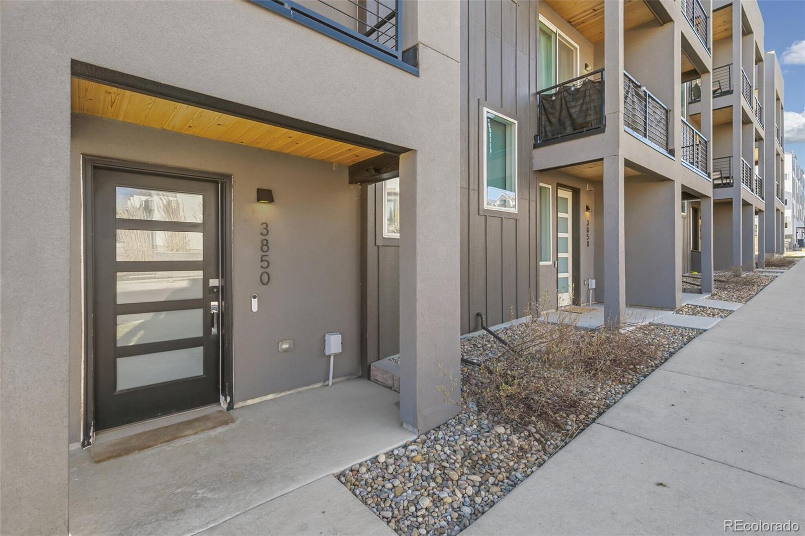 3850 West 13th Avenue Denver, CO 80204 - Photo 26 of 32 front view of a brick house with a outdoor space