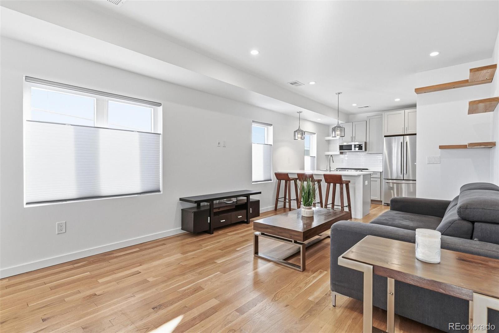 3850 West 13th Avenue Denver, CO 80204 - Photo 3 of 32 a living room with furniture and a wooden floor