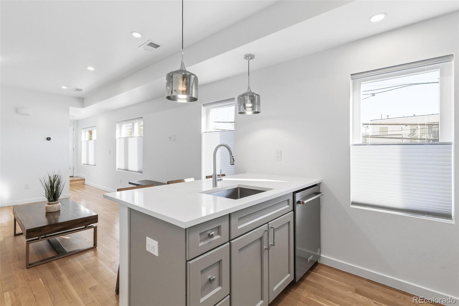 3850 West 13th Avenue Denver, CO 80204 - Photo 10 of 32 a kitchen with a sink and cabinets
