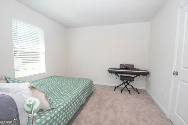a bedroom with a bed and a table in it