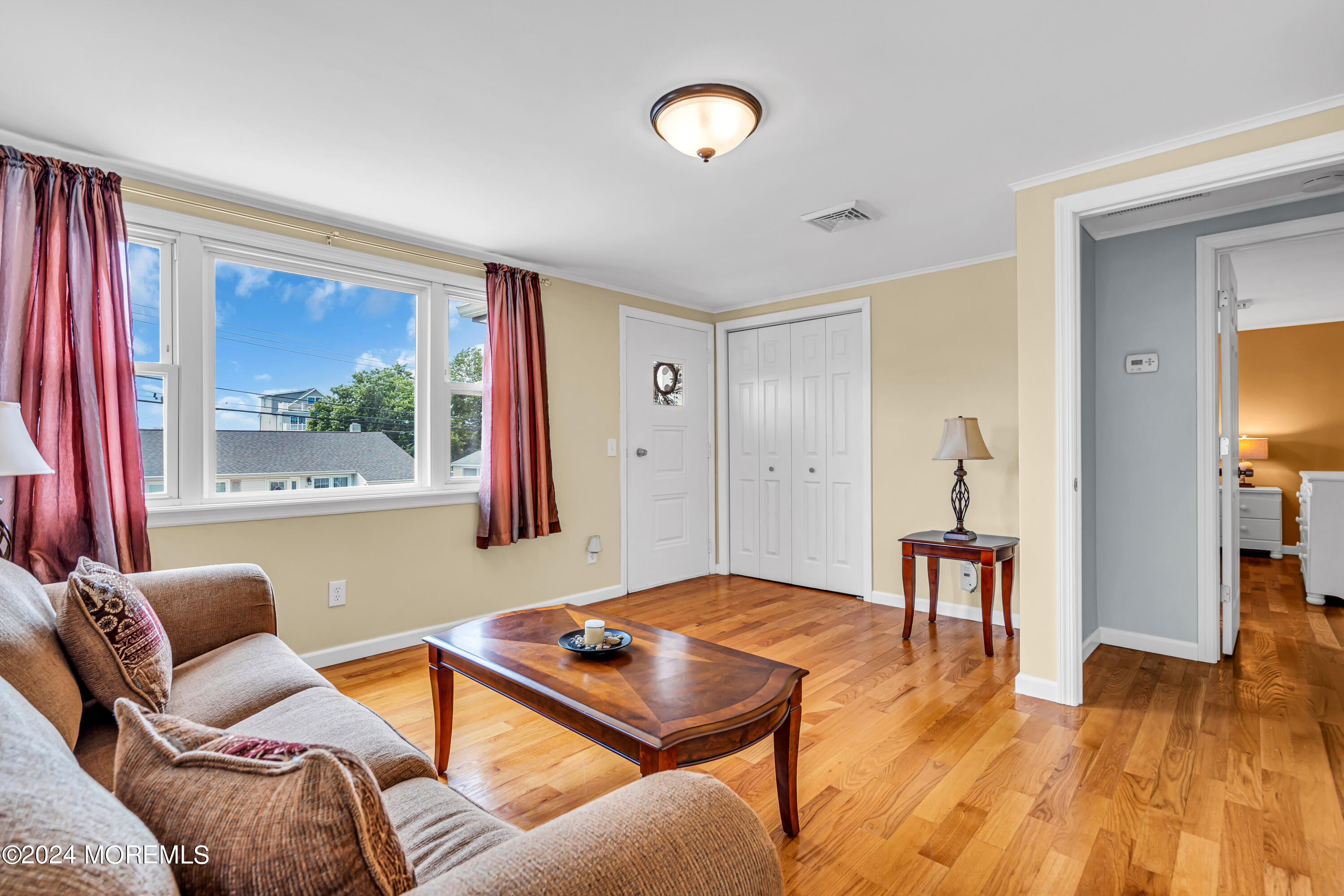 31 Neptune Road Toms River, NJ 08753 - Photo 28 of 84 a living room with furniture a window and a flat screen tv