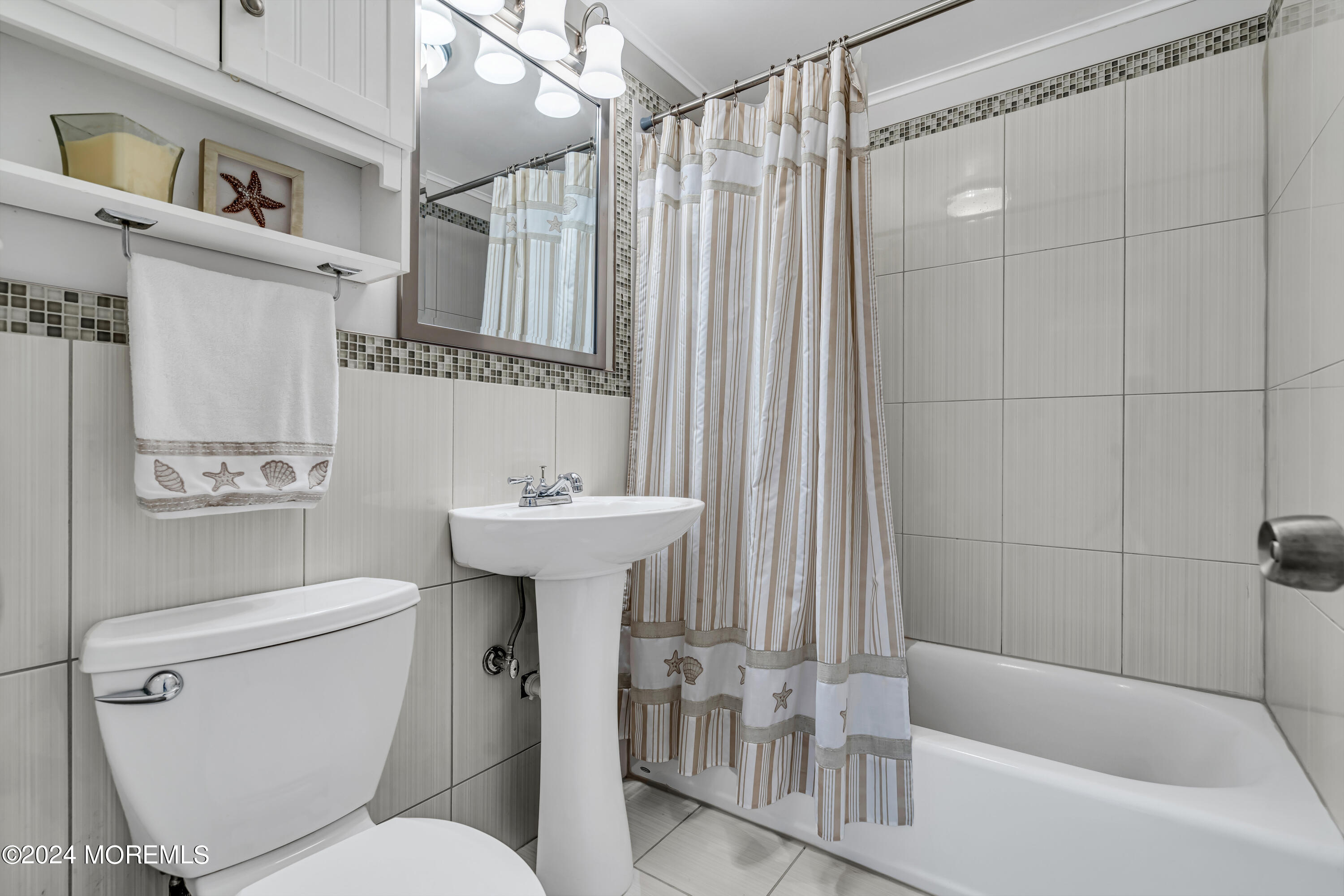 31 Neptune Road Toms River, NJ 08753 - Photo 33 of 84 a bathroom with a sink toilet and shower