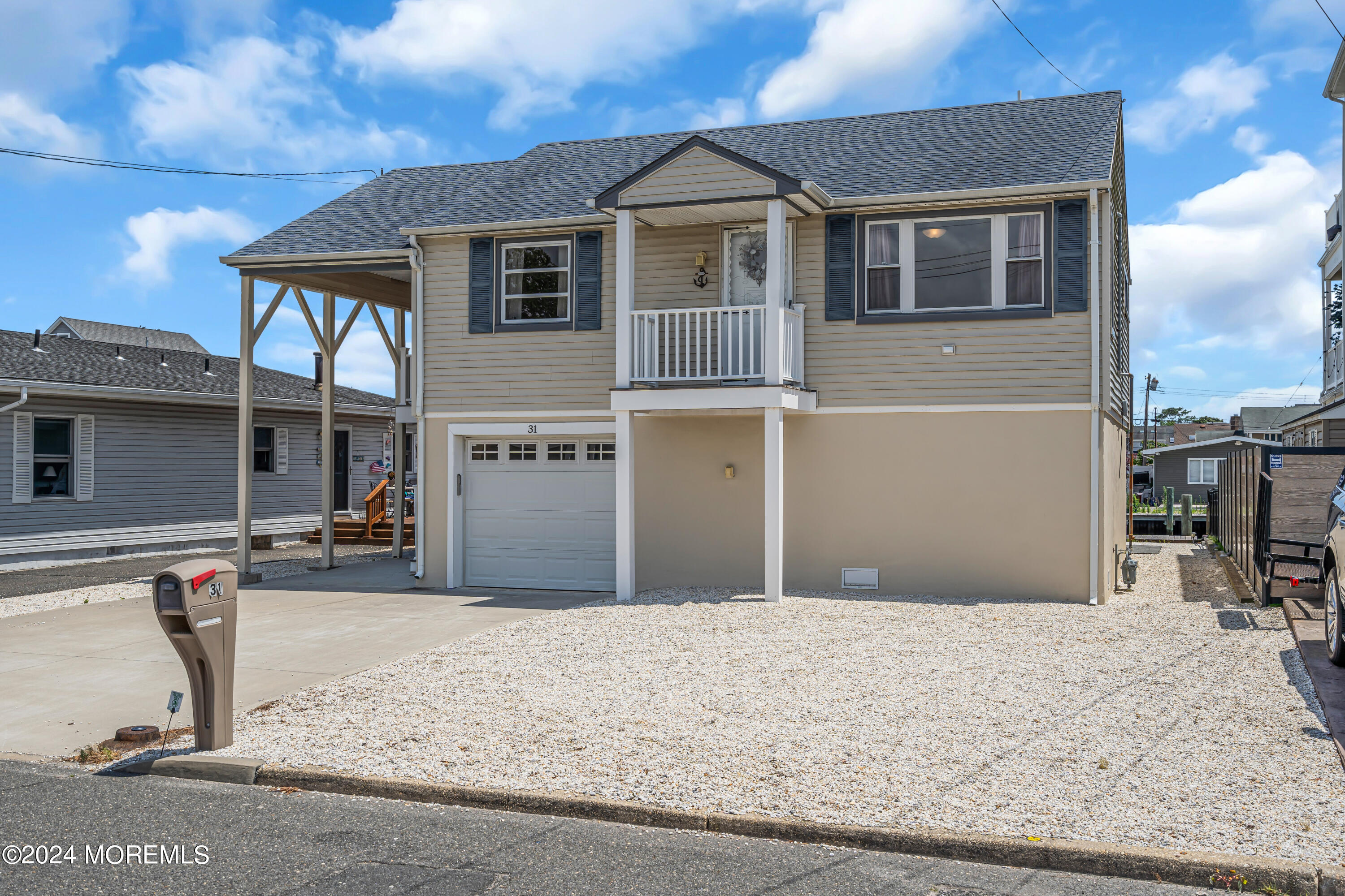 31 Neptune Road Toms River, NJ 08753 - Photo 71 of 84 a front view of a house with a yard and seating space