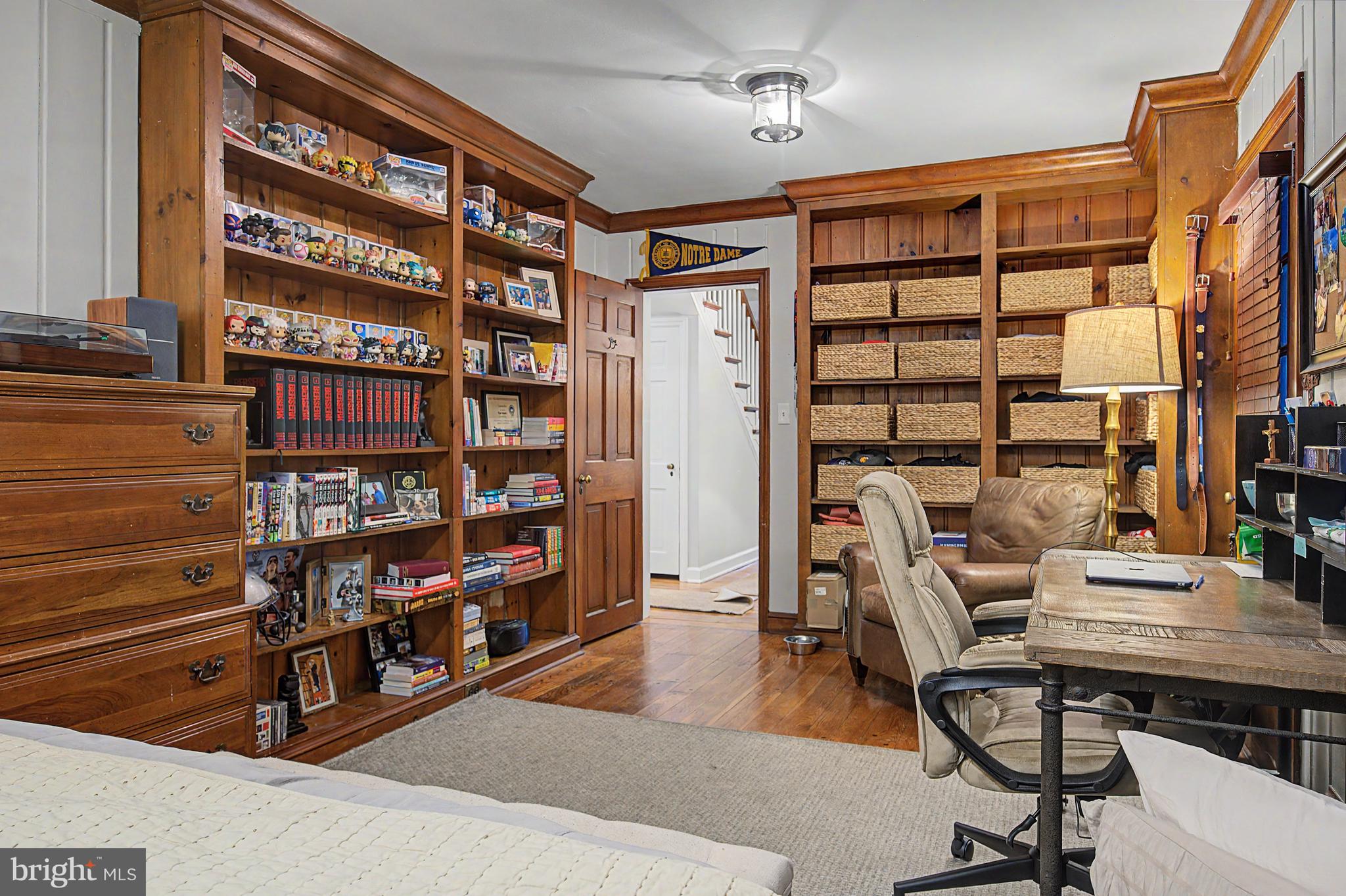 4900 Threadneedle Road Wilmington, DE 19807 - Photo 23 of 49 Den bookcases; Access to backyard from this room.
