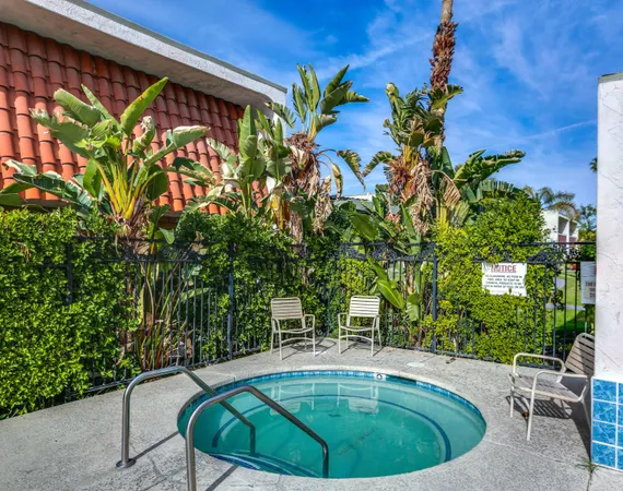 a view of a swimming pool with an outdoor seating