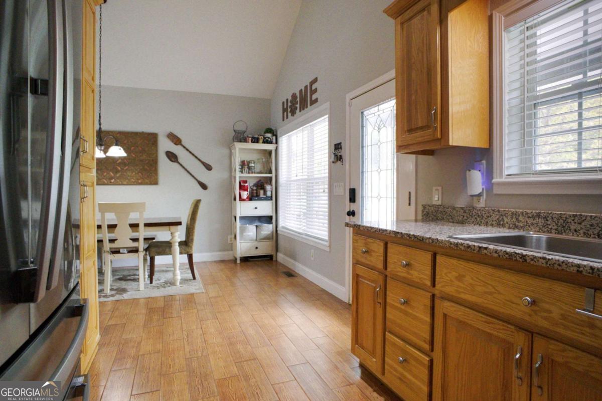 394 Crawford Road, Unit TRK Blairsville, GA 30512 - Photo 12 of 78 a kitchen with stainless steel appliances granite countertop a refrigerator and a stove top oven