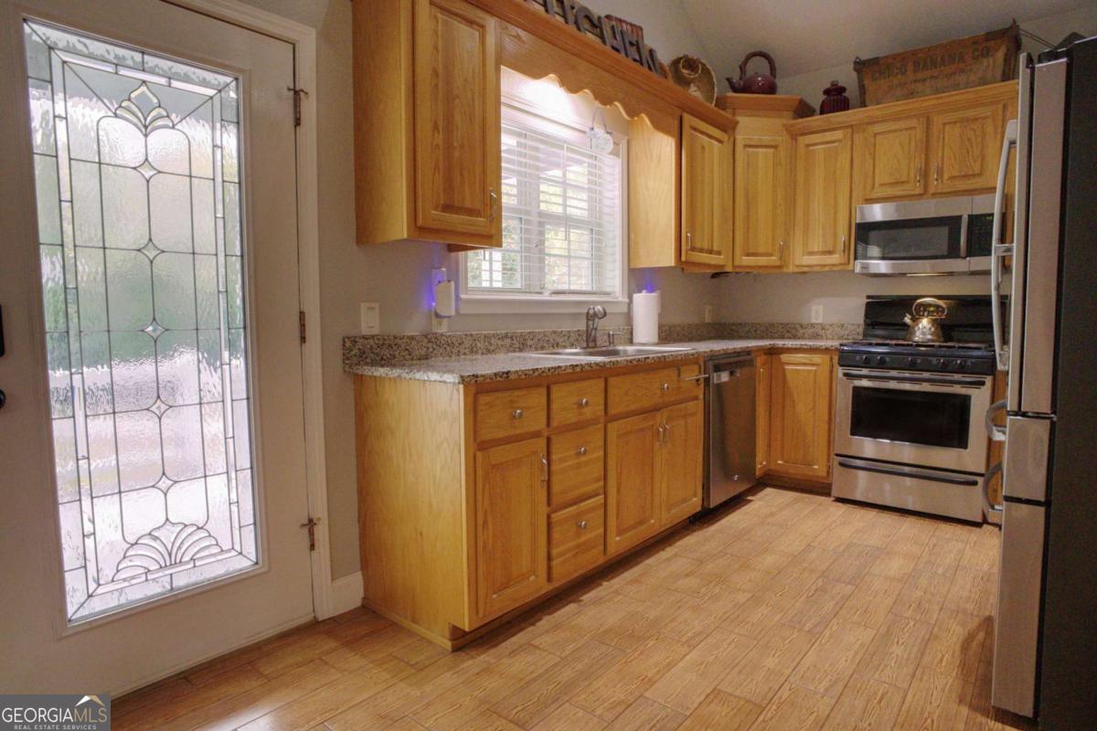 394 Crawford Road, Unit TRK Blairsville, GA 30512 - Photo 2 of 78 a kitchen with stainless steel appliances granite countertop a stove a sink and a microwave