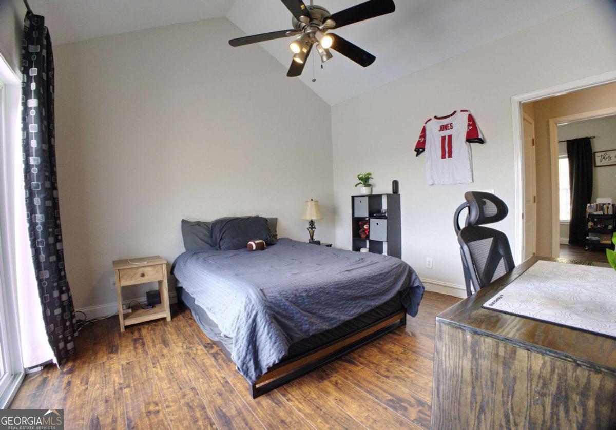 394 Crawford Road, Unit TRK Blairsville, GA 30512 - Photo 30 of 78 a bedroom with a bed and wooden floor