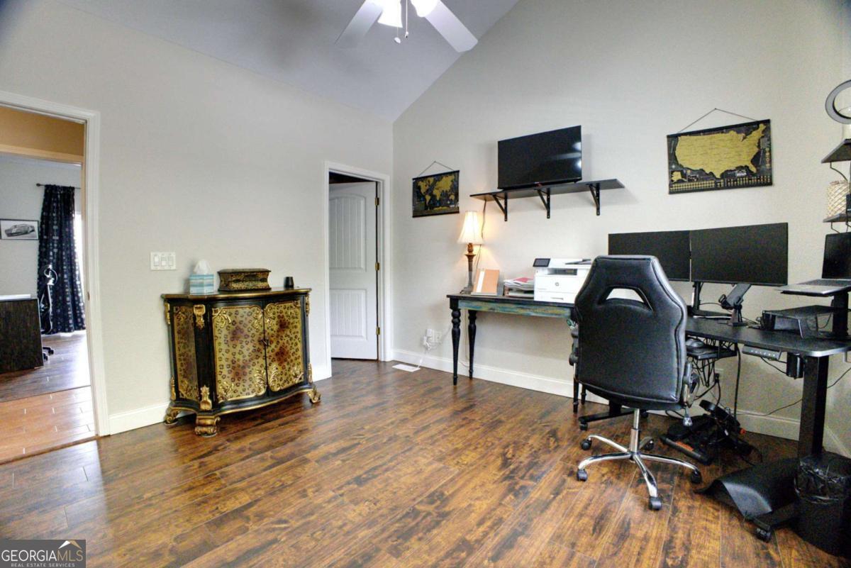 394 Crawford Road, Unit TRK Blairsville, GA 30512 - Photo 33 of 78 a view of a workspace with furniture and a flat screen tv