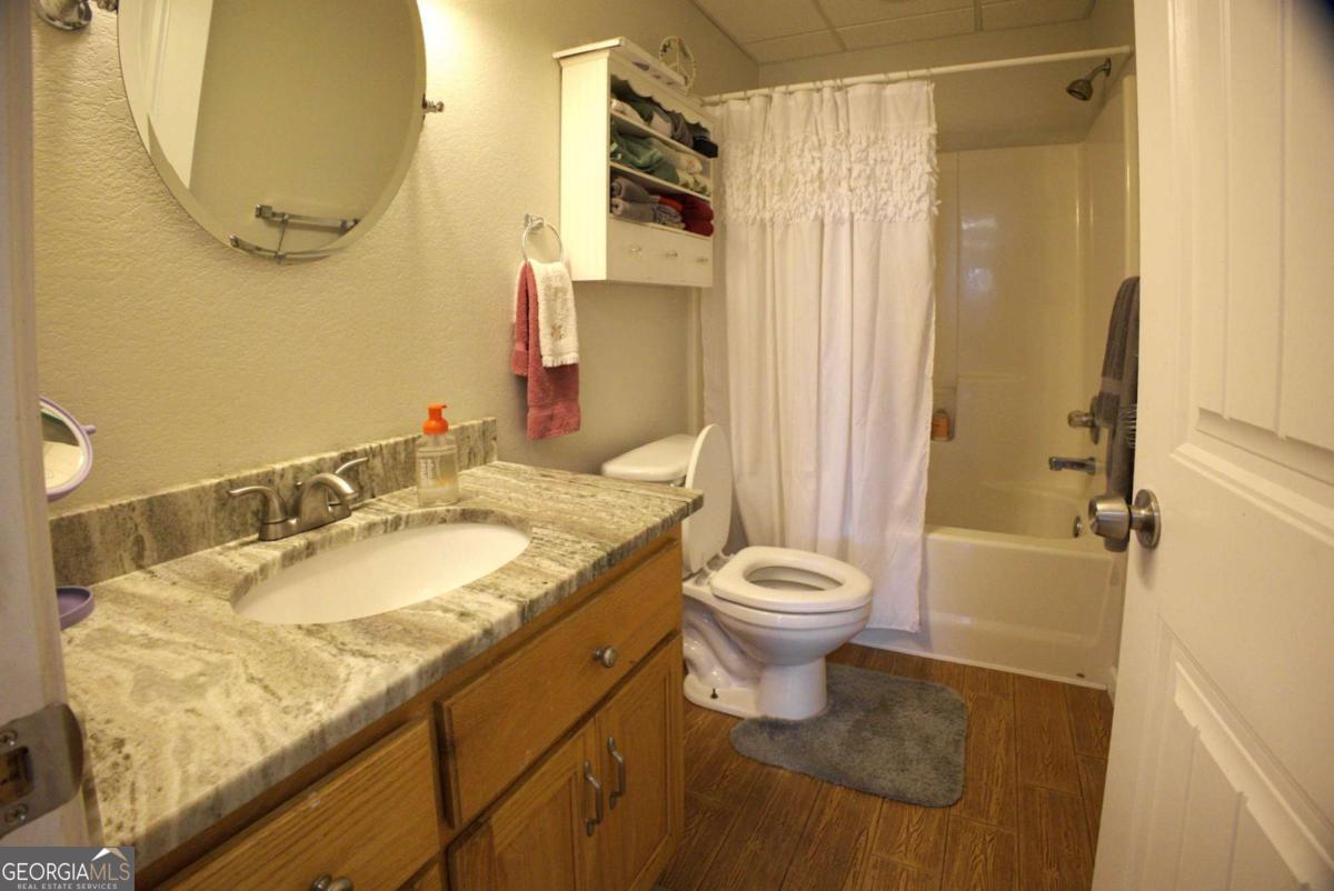 394 Crawford Road, Unit TRK Blairsville, GA 30512 - Photo 41 of 78 a bathroom with a granite countertop sink toilet and shower