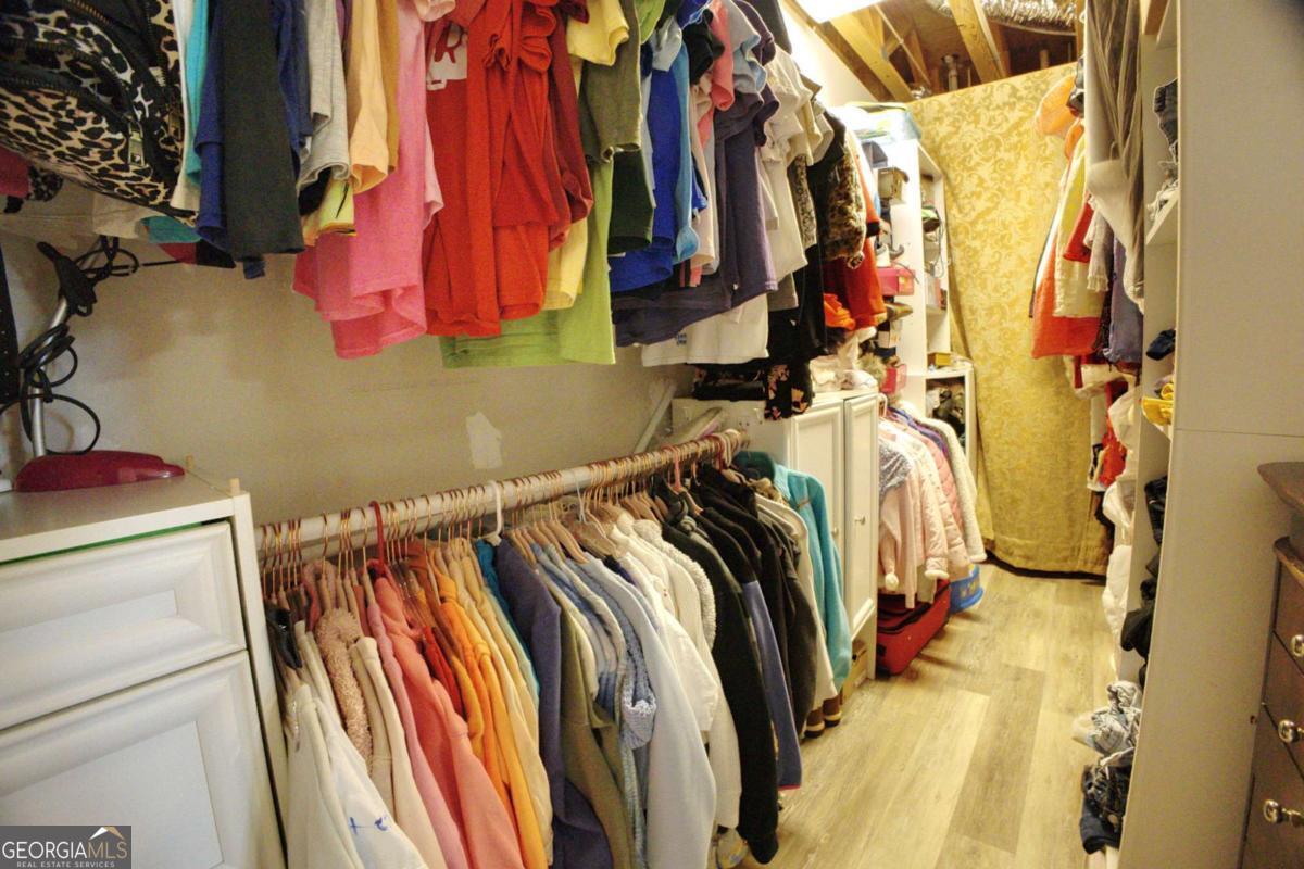 394 Crawford Road, Unit TRK Blairsville, GA 30512 - Photo 46 of 78 a view of walk in closet with clothes and shoes