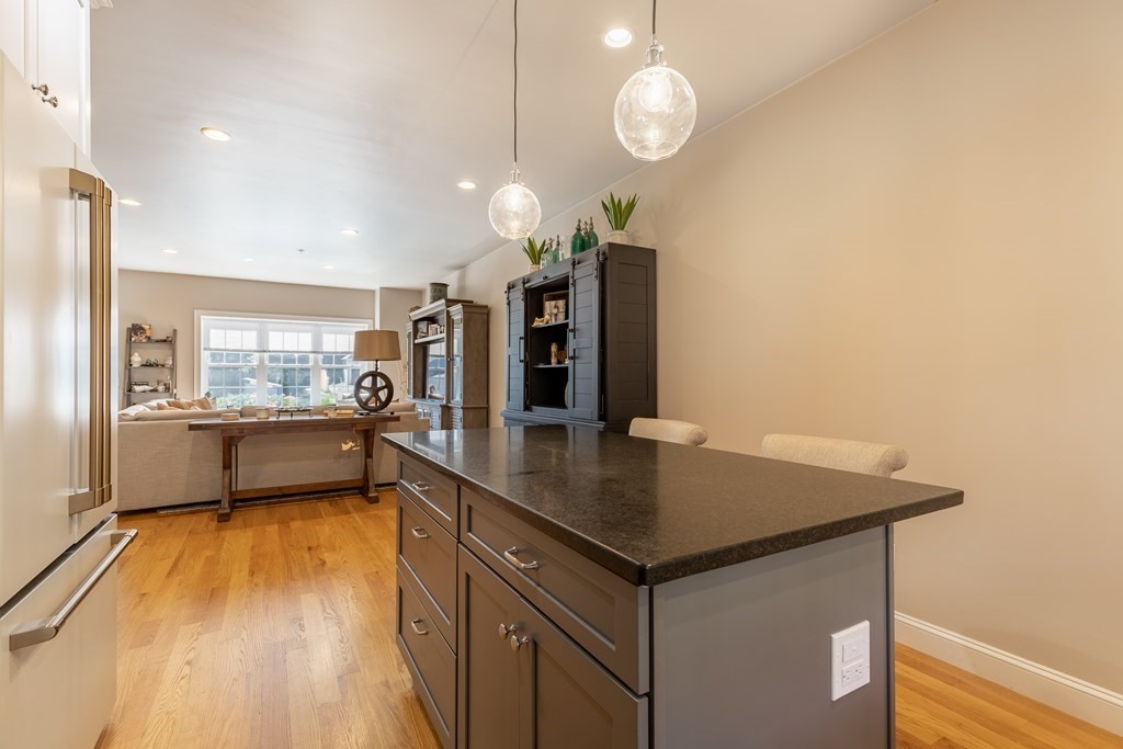 176 Main Street, Unit 3 Medway, MA 02053 - Photo 12 of 28 a kitchen with a sink a counter top space stainless steel appliances and cabinets