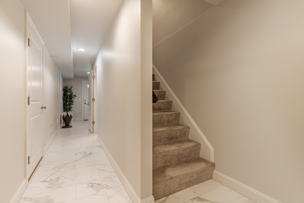 176 Main Street, Unit 3 Medway, MA 02053 - Photo 19 of 28 a view of a hallway with staircase