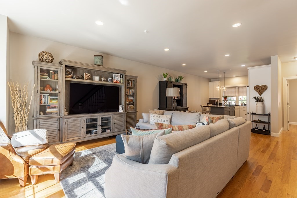 176 Main Street, Unit 3 Medway, MA 02053 - Photo 2 of 28 a living room with furniture and a flat screen tv