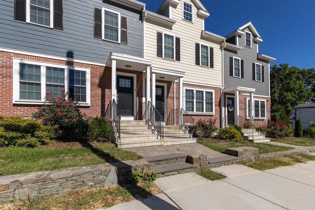 176 Main Street, Unit 3 Medway, MA 02053 - Photo 25 of 28 a front view of a house with a yard
