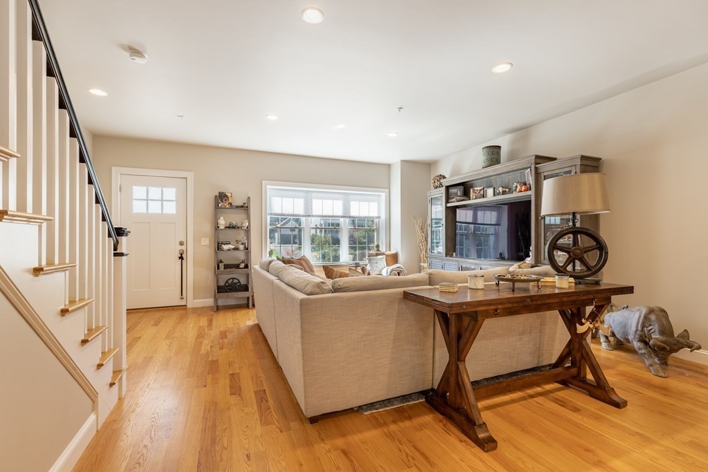 176 Main Street, Unit 3 Medway, MA 02053 - Photo 4 of 28 a living room with furniture a rug and a large window