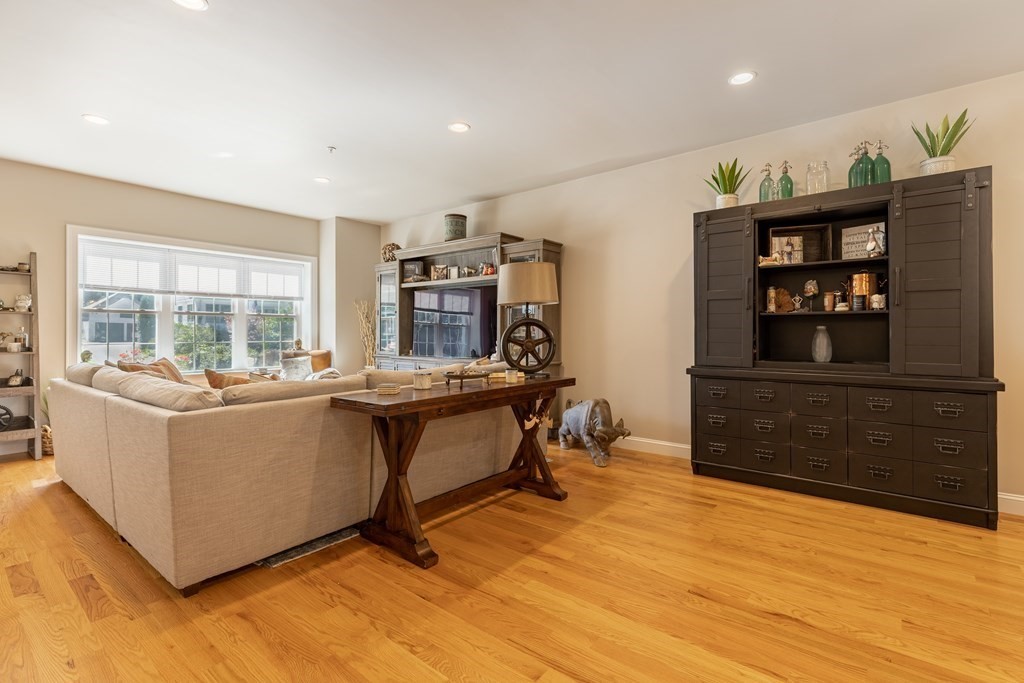 176 Main Street, Unit 3 Medway, MA 02053 - Photo 7 of 28 a living room with furniture and wooden floor
