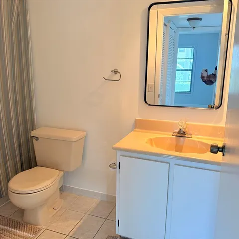 an empty room with cabinet and window