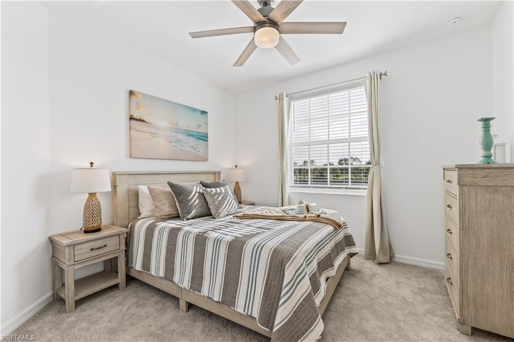 43997 Boardwalk Loop, Unit 1821 Babcock Ranch, FL 33982 - Photo 11 of 14 a bedroom with a bed and a window