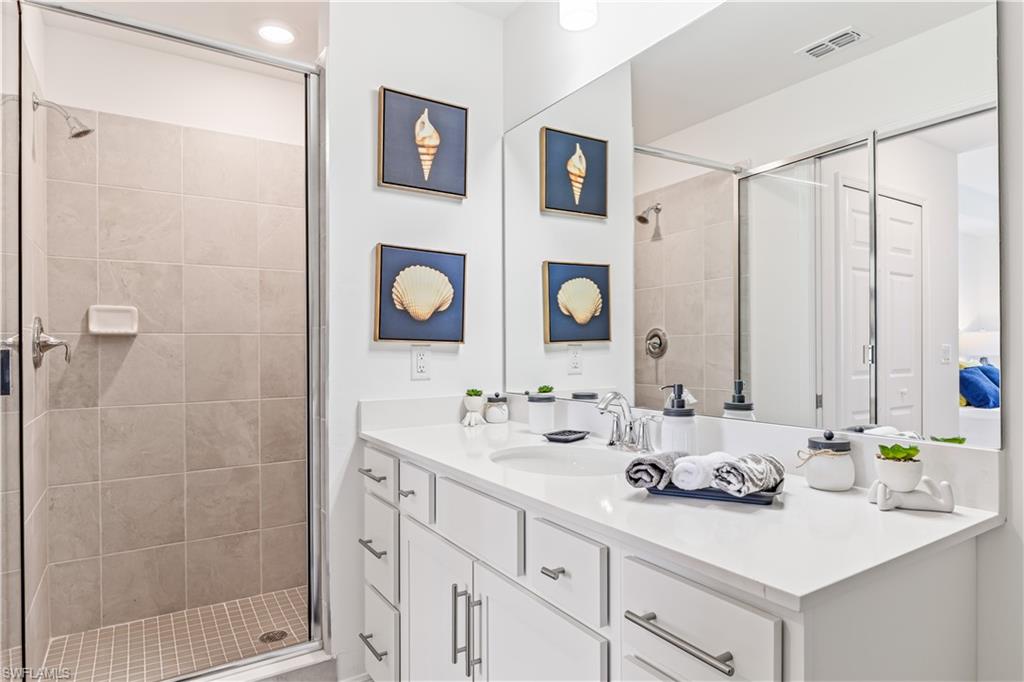 43997 Boardwalk Loop, Unit 1821 Babcock Ranch, FL 33982 - Photo 13 of 14 a bathroom with a sink and a mirror