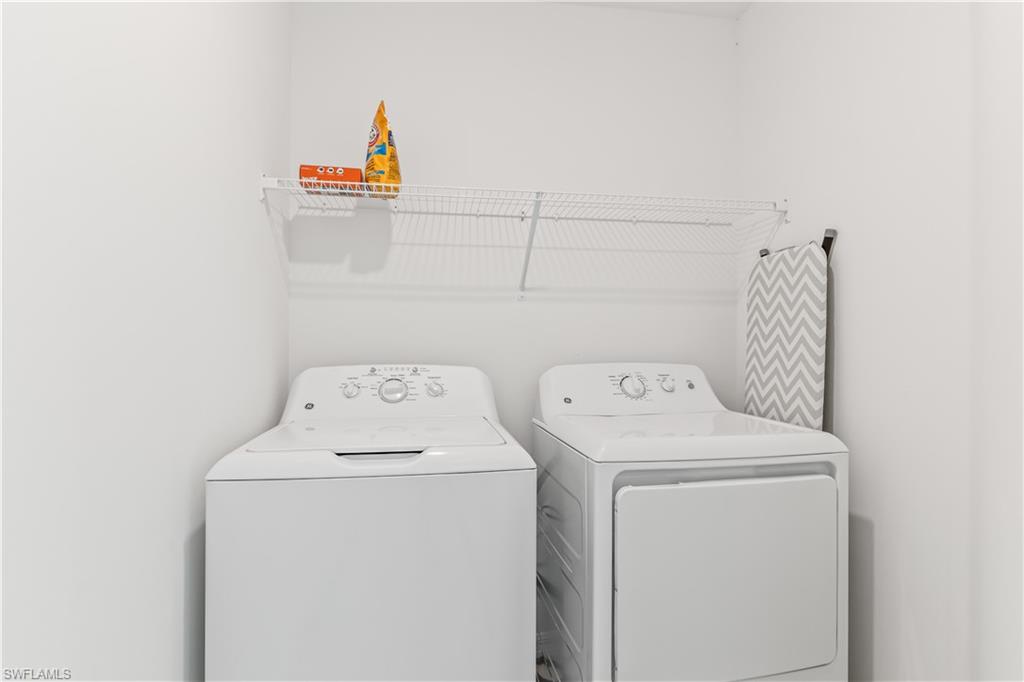 43997 Boardwalk Loop, Unit 1821 Babcock Ranch, FL 33982 - Photo 14 of 14 a utility room with dryer and washer