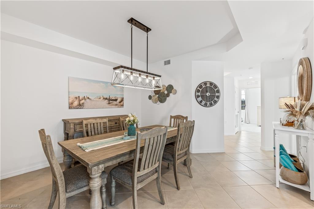 43997 Boardwalk Loop, Unit 1821 Babcock Ranch, FL 33982 - Photo 4 of 14 a view of a dining room with furniture