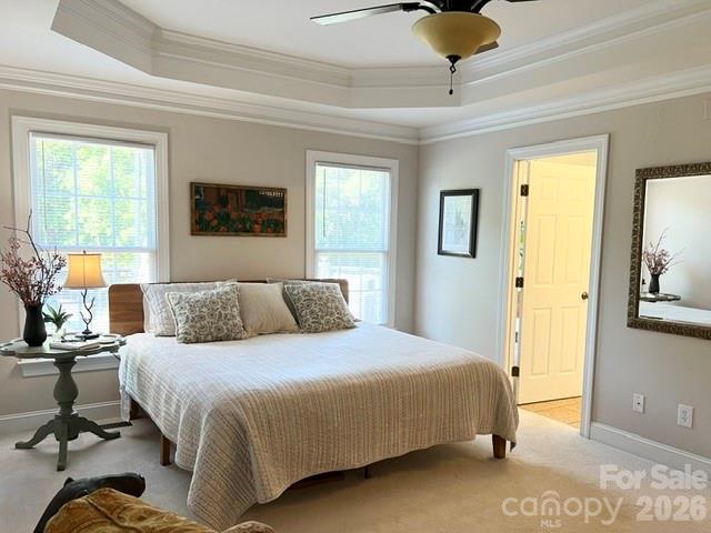 183 Burl Bridges Road Forest City, NC 28043 - Photo 15 of 31 a bedroom with a bed and a chandelier