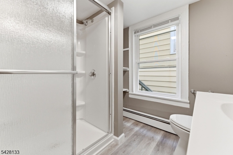 58 Bridge Street Milford, NJ 08848 - Photo 11 of 13 a bathroom with a bathtub and a shower