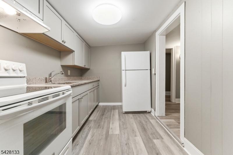 58 Bridge Street Milford, NJ 08848 - Photo 6 of 13 a kitchen with a stove a refrigerator and a sink